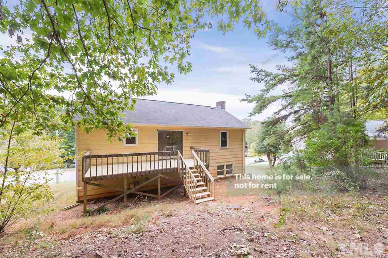 7809 Foxwood Drive Raleigh, NC 27615 - Photo 5 of 17 a view of a house with a yard