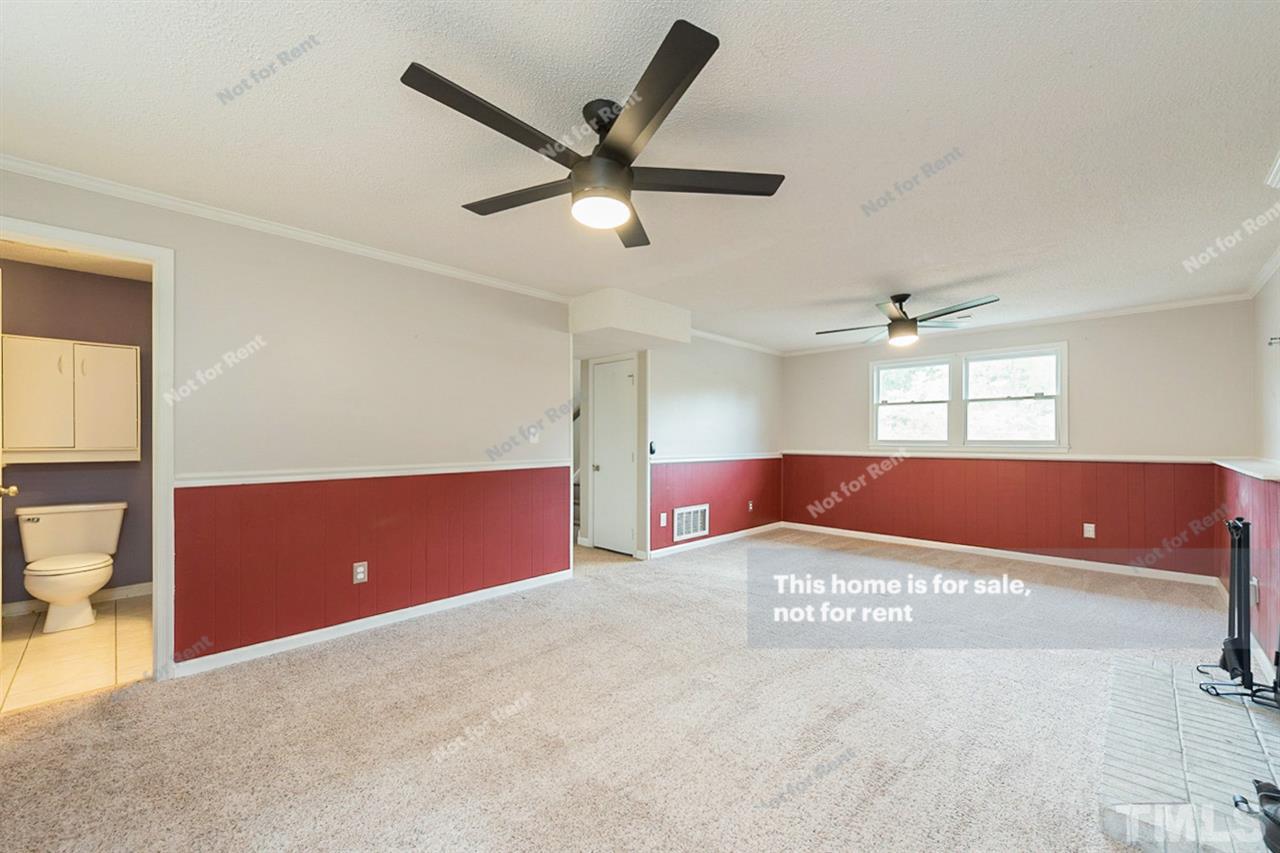 7809 Foxwood Drive Raleigh, NC 27615 - Photo 9 of 17 a view of an empty room and window