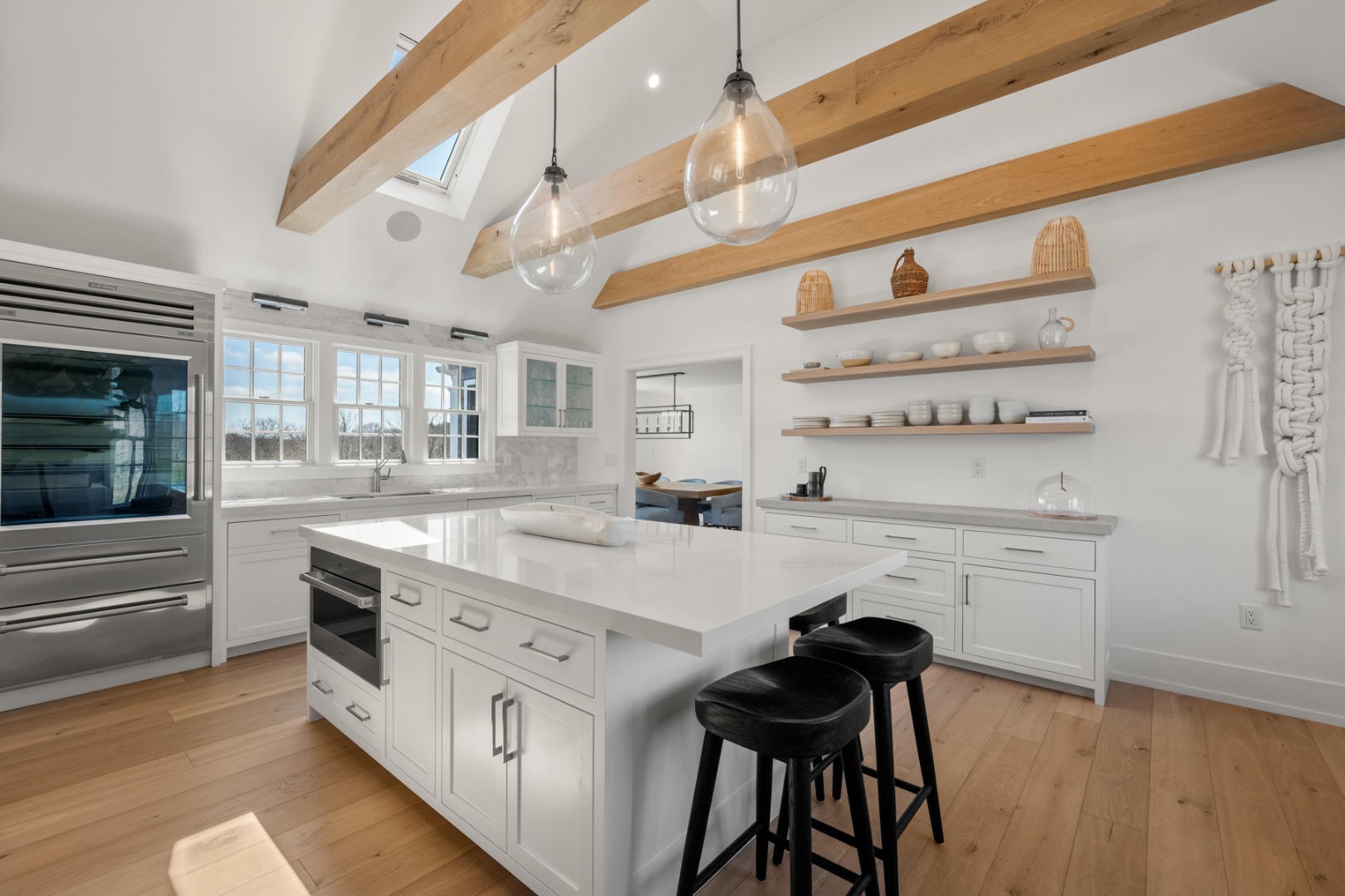174 Cliff Road Nantucket, MA 02554 - Photo 15 of 49 a kitchen with cabinets and wooden floor