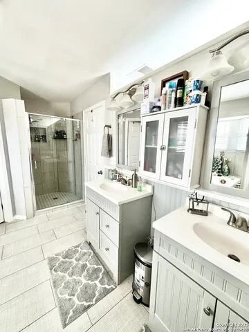 a bathroom with a sink and mirror