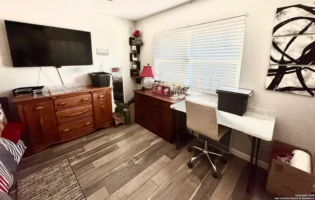 a view of a workspace with furniture