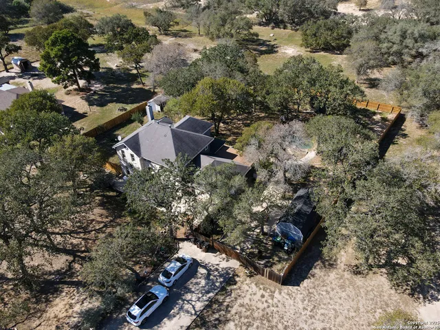 an aerial view of residential house with outdoor space