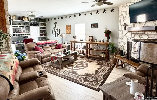 a living room with furniture and a flat screen tv