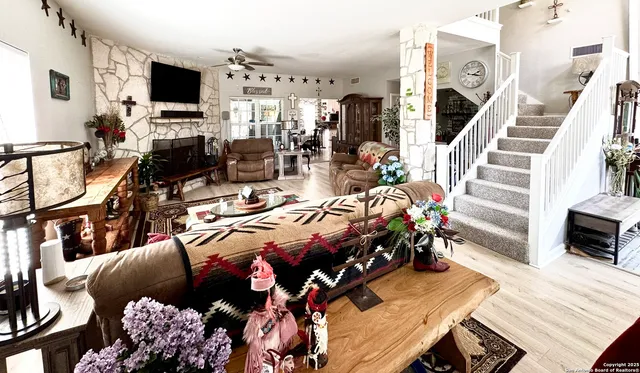 a bed room with furniture and a flat screen tv