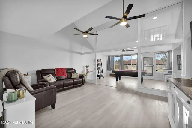 a bathroom with a sink a large mirror and a shower
