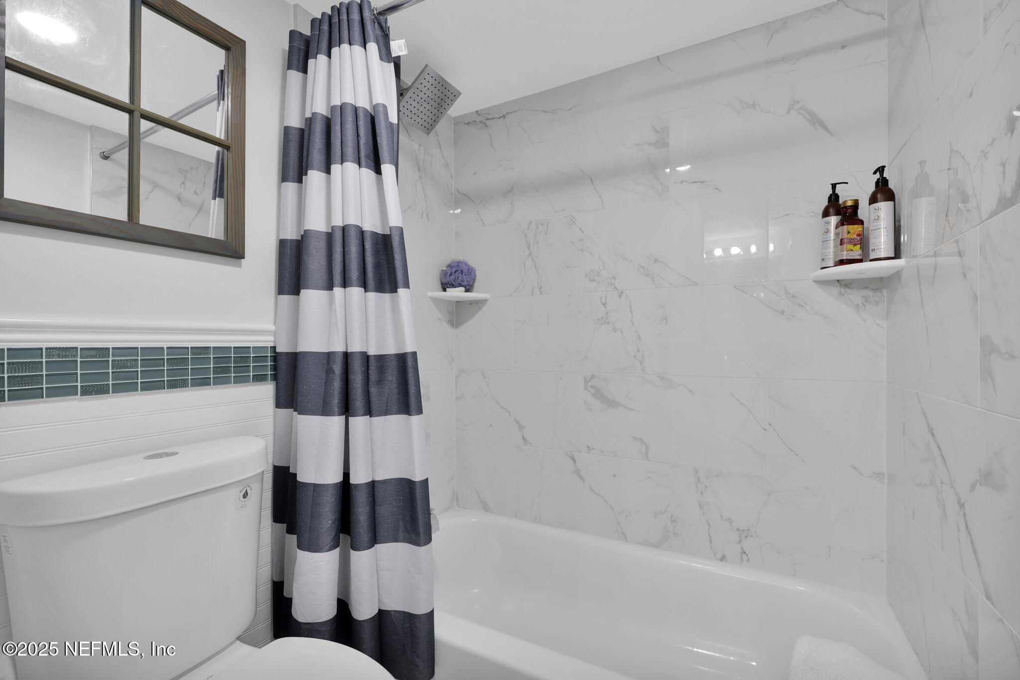 7170 Cypress Cove Road, Unit 28 Jacksonville, FL 32244 - Photo 16 of 22 a bathroom with a toilet a sink and bathtub