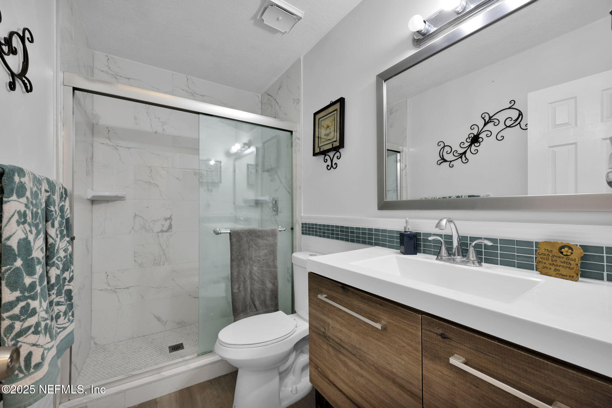 7170 Cypress Cove Road, Unit 28 Jacksonville, FL 32244 - Photo 20 of 22 a bathroom with a sink toilet and shower