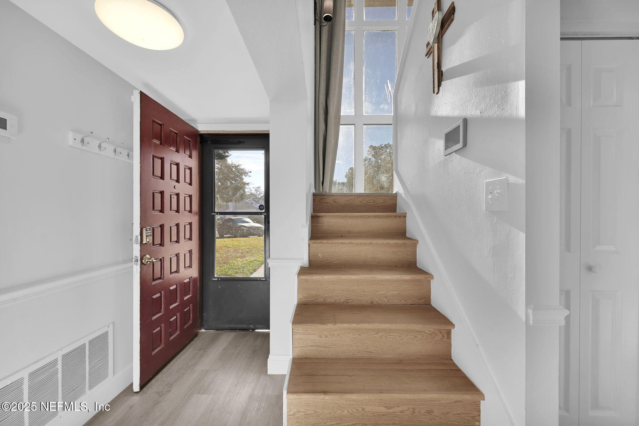 7170 Cypress Cove Road, Unit 28 Jacksonville, FL 32244 - Photo 3 of 22 a view of an entryway with staircase