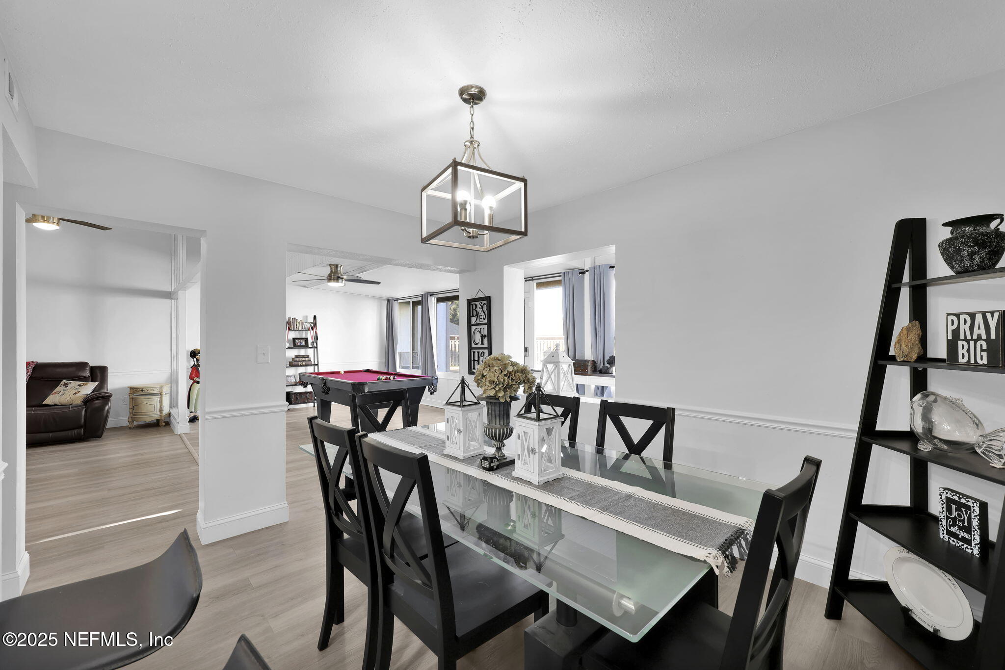 7170 Cypress Cove Road, Unit 28 Jacksonville, FL 32244 - Photo 7 of 22 a view of a dining room with furniture and a chandelier