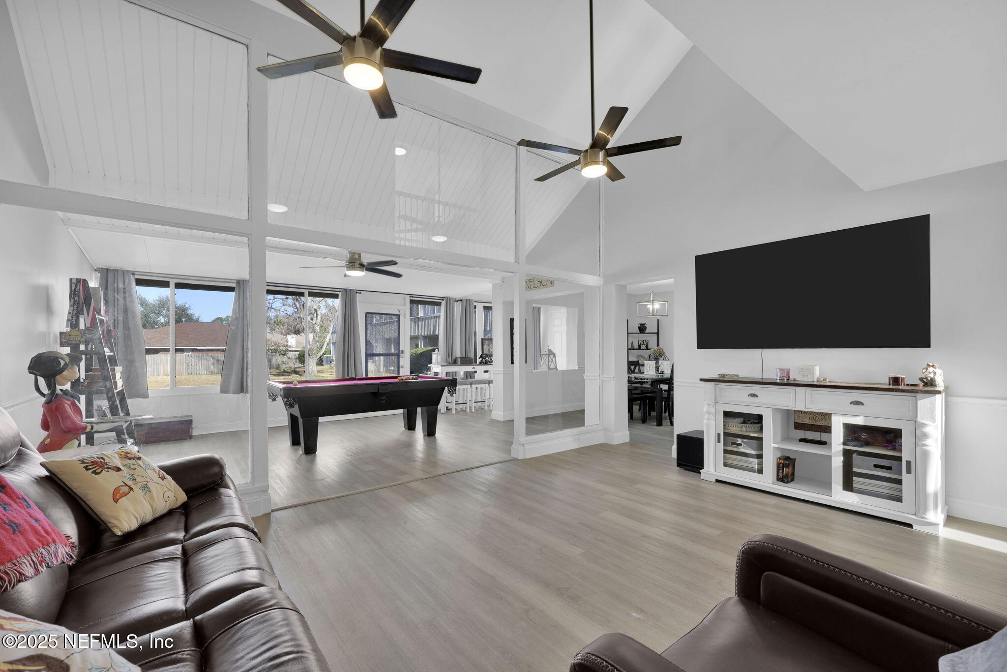 7170 Cypress Cove Road, Unit 28 Jacksonville, FL 32244 - Photo 10 of 22 a living room with furniture and a flat screen tv