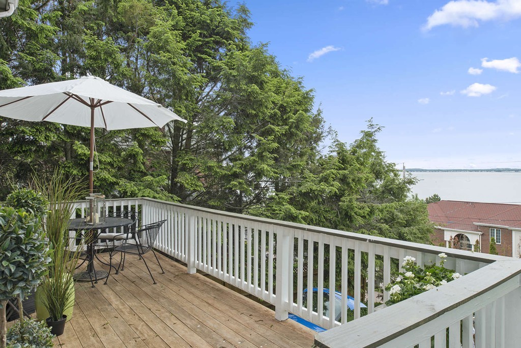 23 Crabtree Road Quincy, MA 02171 - Photo 11 of 20 a view of balcony with outdoor seating and wooden floor