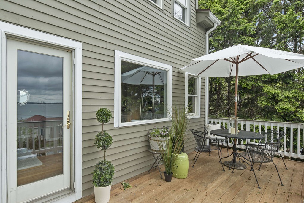23 Crabtree Road Quincy, MA 02171 - Photo 12 of 20 a view of a patio with a table and chairs under an umbrella
