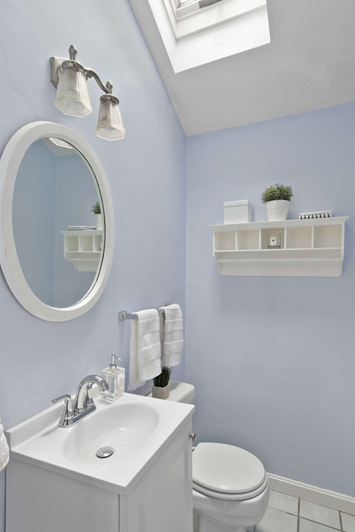 23 Crabtree Road Quincy, MA 02171 - Photo 15 of 20 a bathroom with a toilet sink vanity and mirror