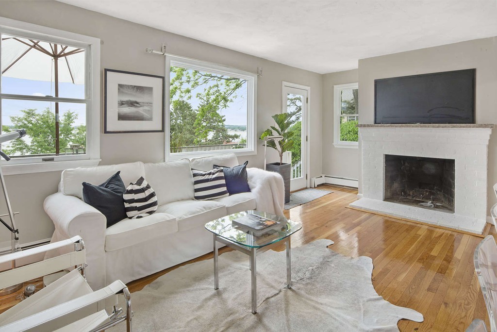 23 Crabtree Road Quincy, MA 02171 - Photo 4 of 20 a living room with furniture a large window and a flat screen tv