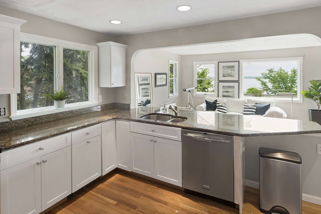 23 Crabtree Road Quincy, MA 02171 - Photo 6 of 20 a kitchen with a sink stove and cabinets