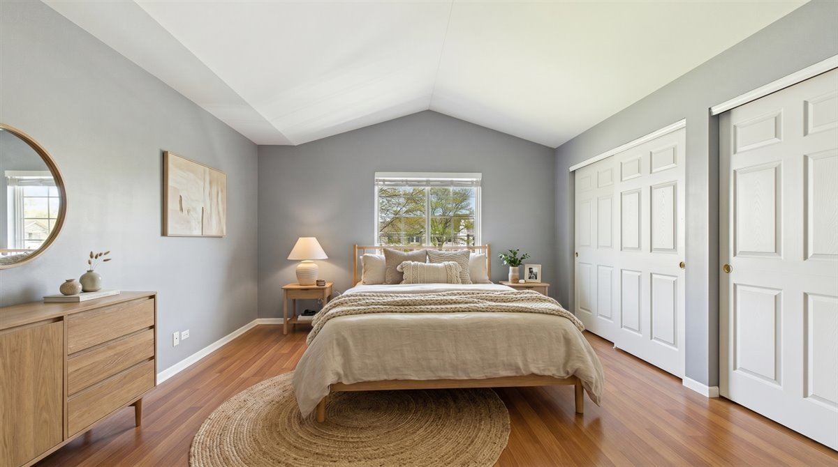 1480 Tudor Drive Mundelein, IL 60060 - Photo 17 of 29 a bedroom with a bed and a dresser