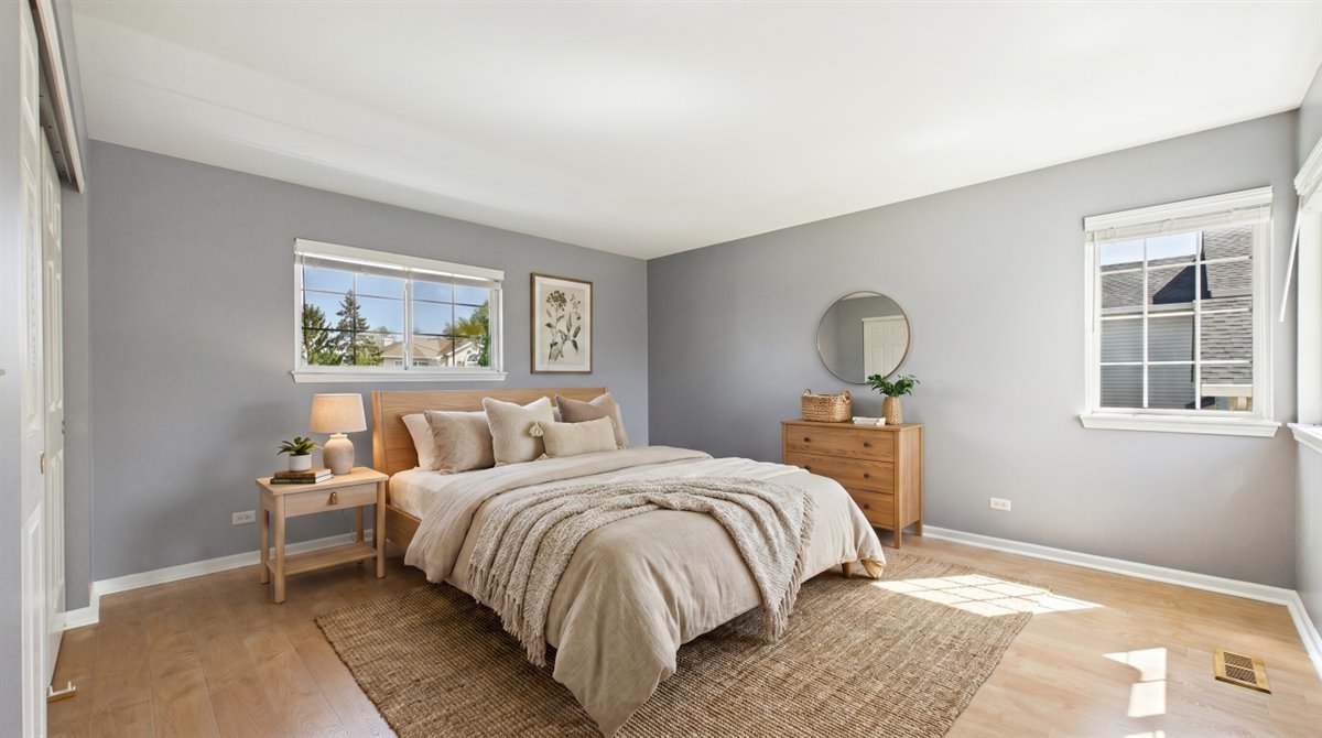 1480 Tudor Drive Mundelein, IL 60060 - Photo 20 of 29 a bedroom with a bed lamp and window