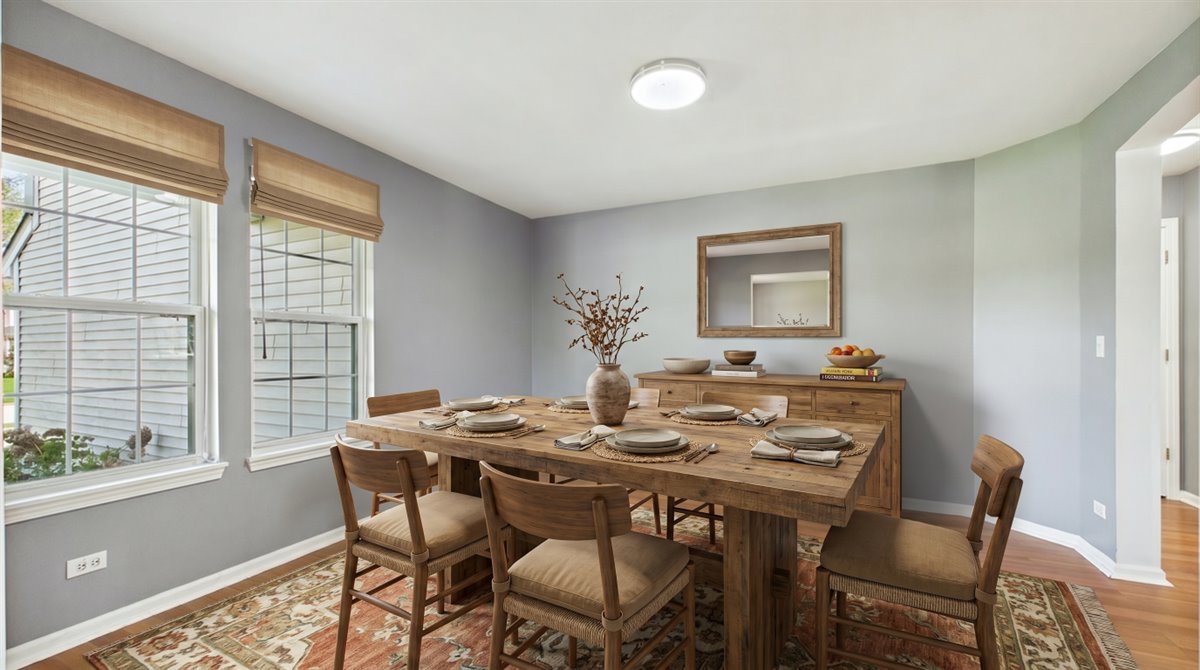 1480 Tudor Drive Mundelein, IL 60060 - Photo 5 of 29 a view of a dining room with furniture window and outside view