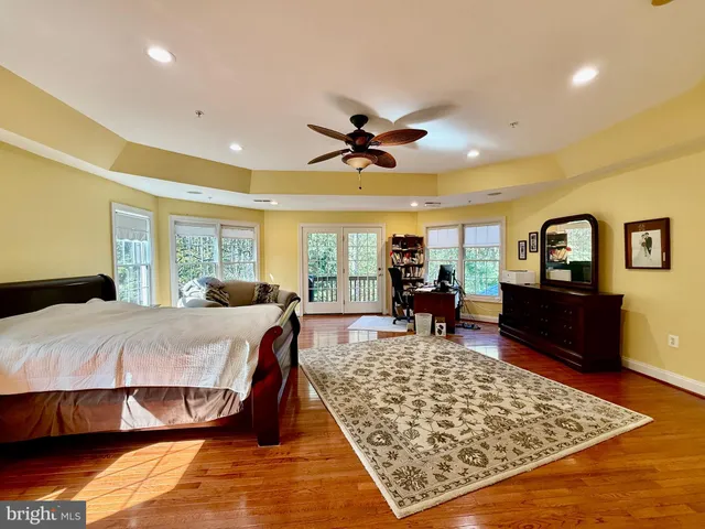 a view of a kitchen with a sink and large window