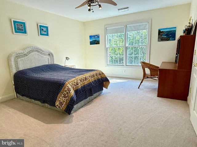 a bed room with a bed and mirror