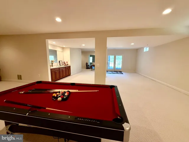 a view of a yard with yellow flowers