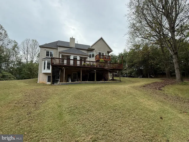 a living room with lots of furniture and a window
