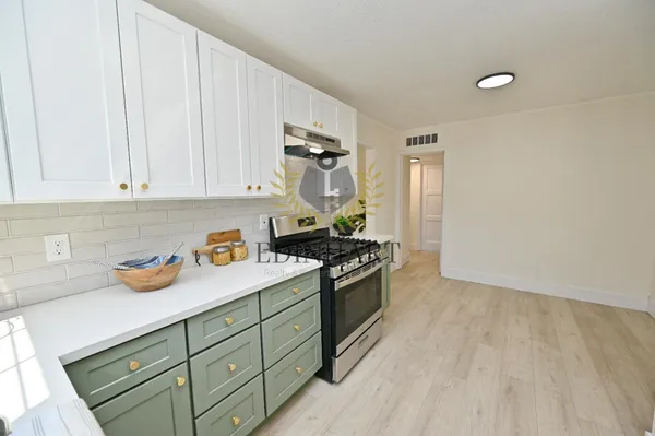 a kitchen with a sink and cabinets