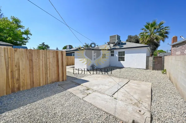 a view of a room with window and wooden floor