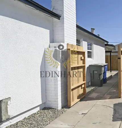 a kitchen with stainless steel appliances granite countertop a stove and a wooden floors