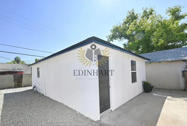 a kitchen with granite countertop a stove top oven