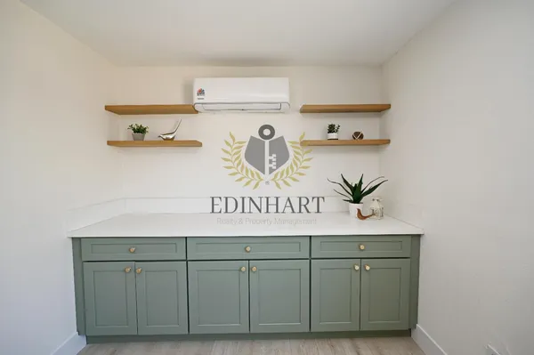 a bathroom with a sink toilet and mirror