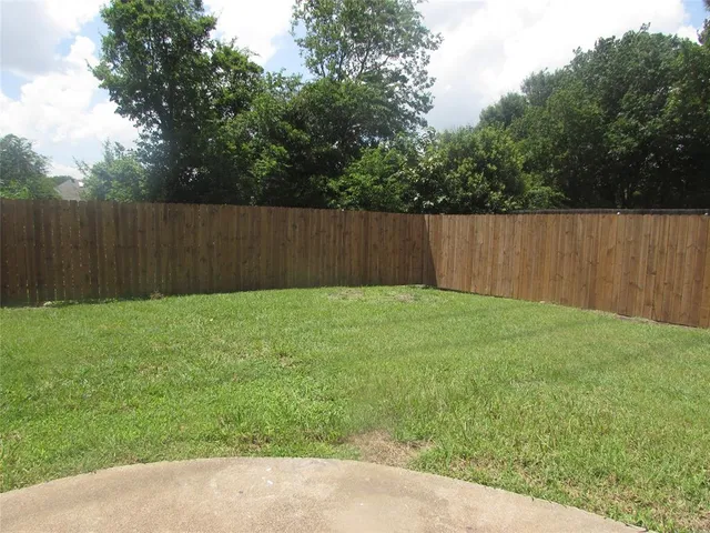 a front view of a house with yard and garage