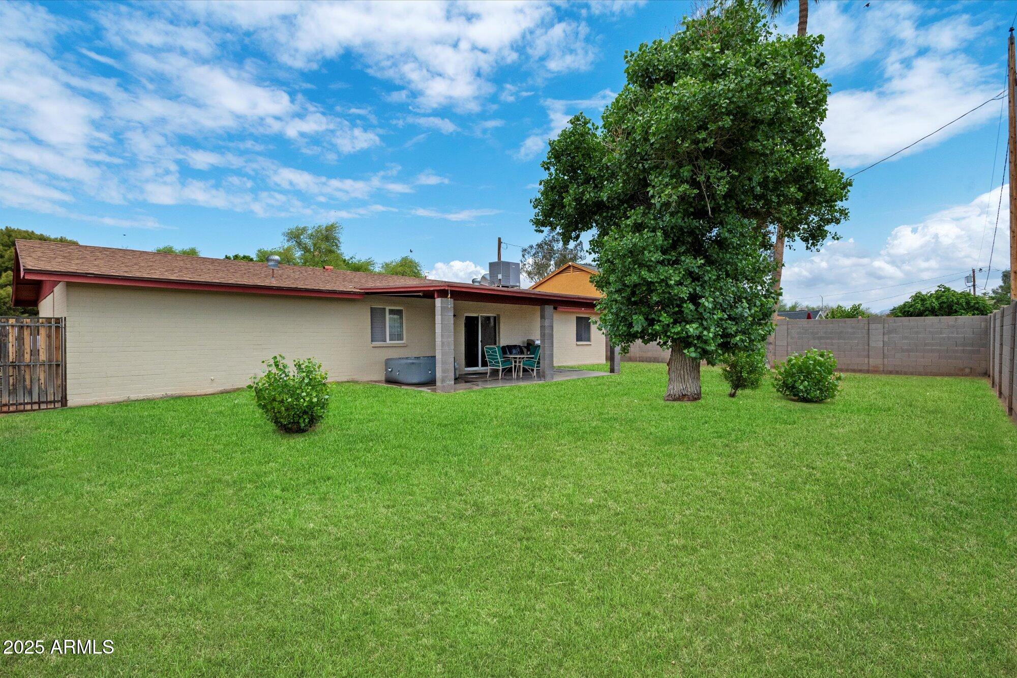 4333 East Desert Cactus Street Phoenix, AZ 85032 - Photo 15 of 18 a view of a house with a yard
