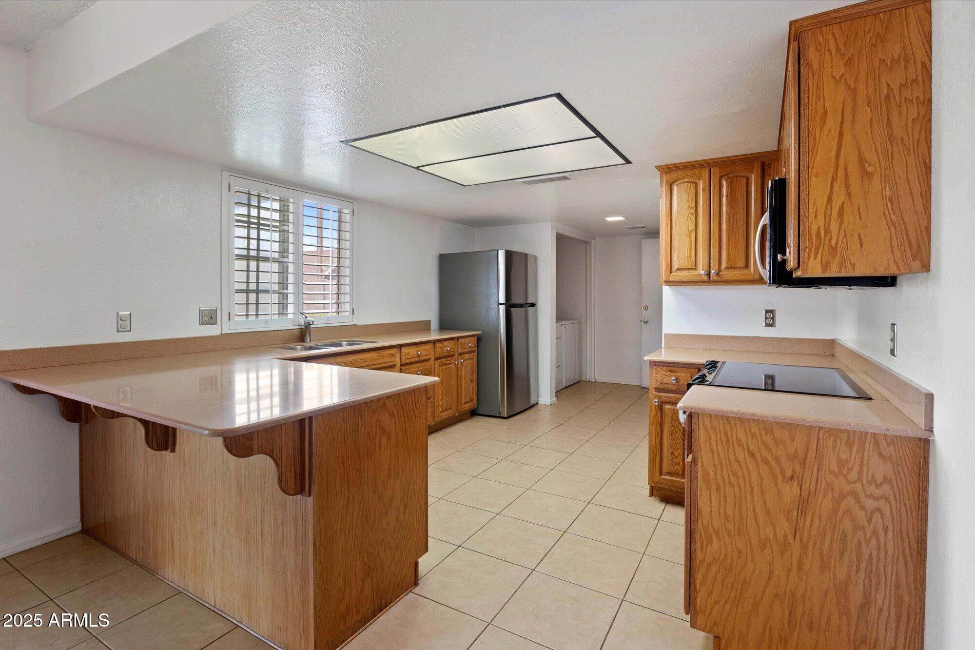 4333 East Desert Cactus Street Phoenix, AZ 85032 - Photo 6 of 18 a room with storage and utility