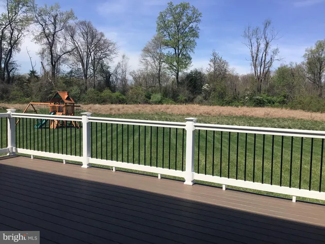 a view of deck with a large trees