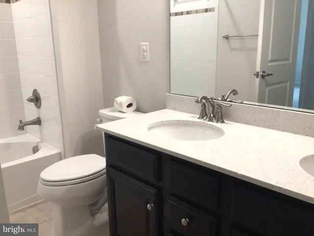 a view of an empty room and a window