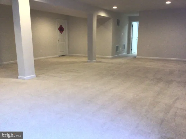an aerial view of swimming pool patio and lake view