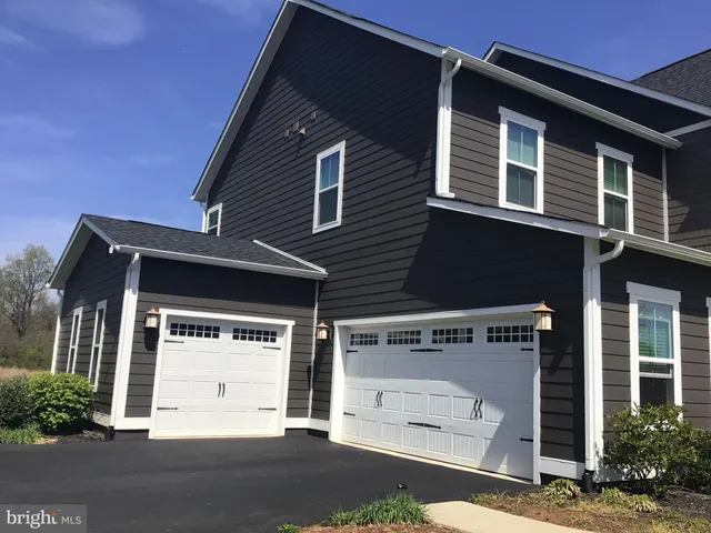 a front view of a house with a garage