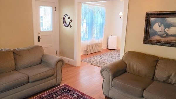 45 Wachusett Street Springfield, MA 01118 - Photo 9 of 23 a living room with furniture and a rug