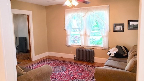 45 Wachusett Street Springfield, MA 01118 - Photo 10 of 23 a living room with furniture and a window