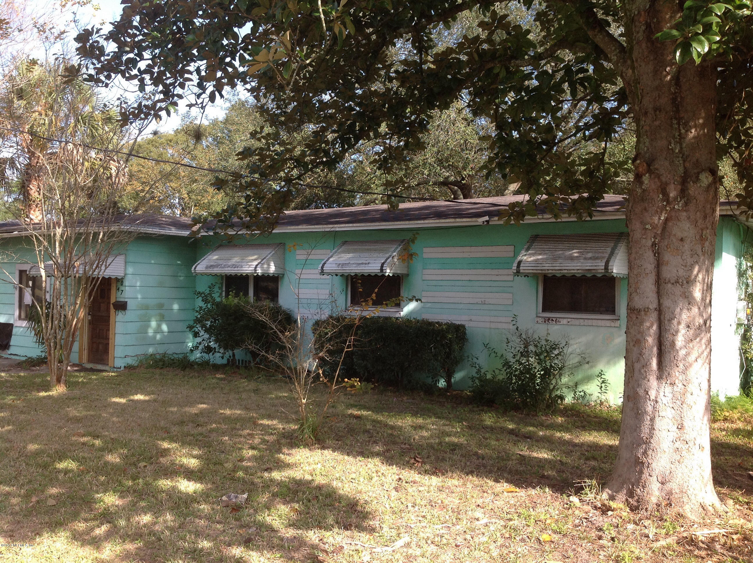 2047 Gamewell Road Jacksonville, FL 32211 - Photo 1 of 11 a front view of a house with a yard