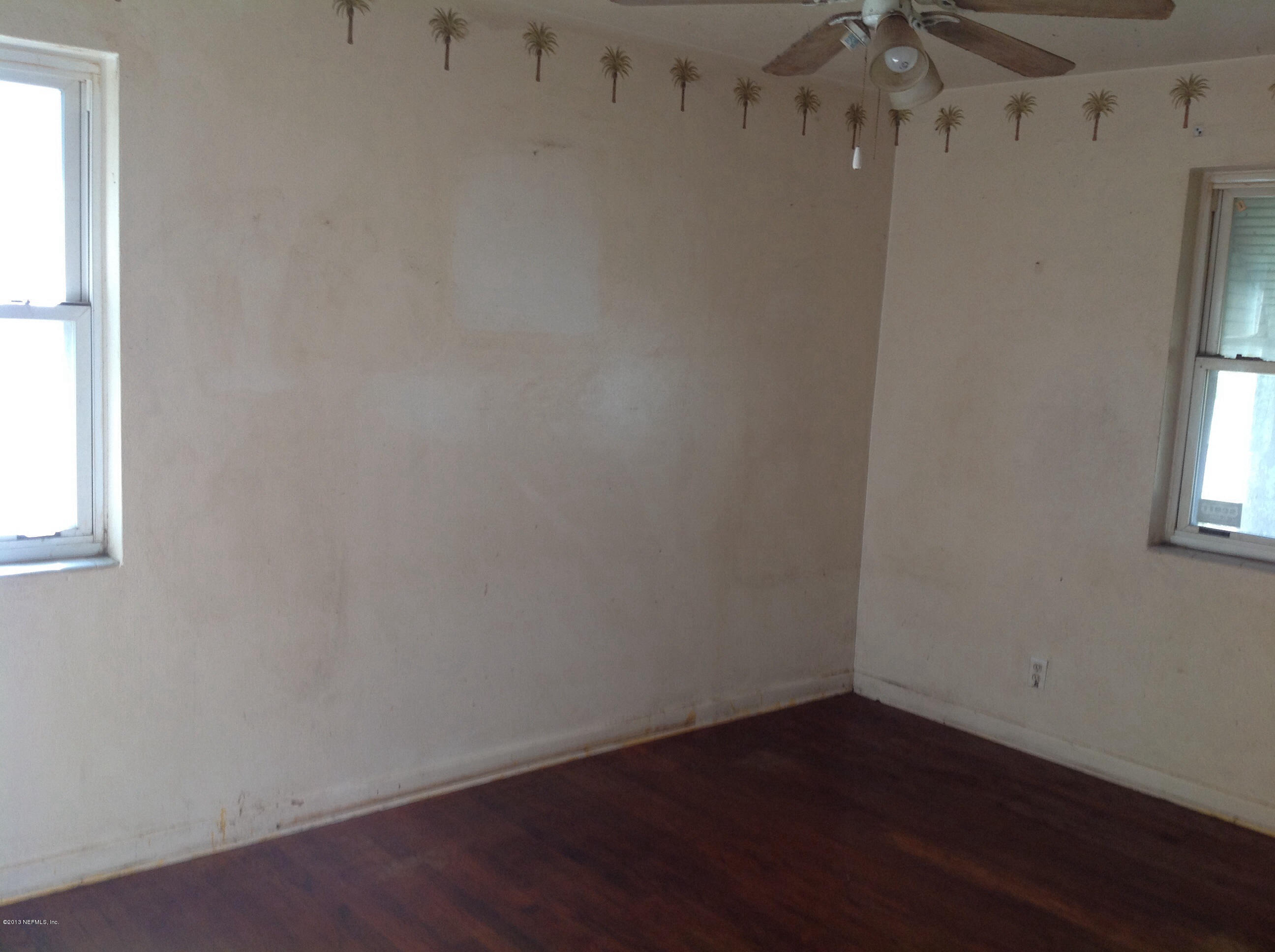2047 Gamewell Road Jacksonville, FL 32211 - Photo 8 of 11 an empty room with wooden floor and windows