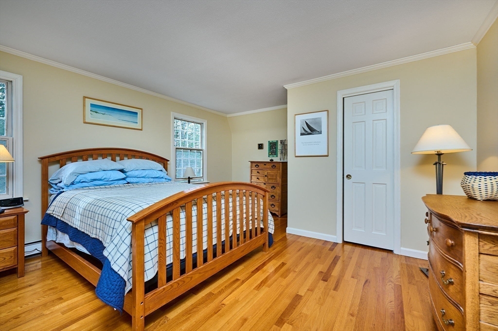 91 Montague Road Westhampton, MA 01027 - Photo 17 of 41 a bedroom with a bed and a table in it
