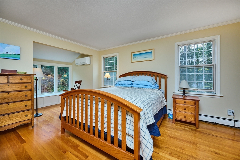 91 Montague Road Westhampton, MA 01027 - Photo 18 of 41 a bedroom with a bed and wooden floor