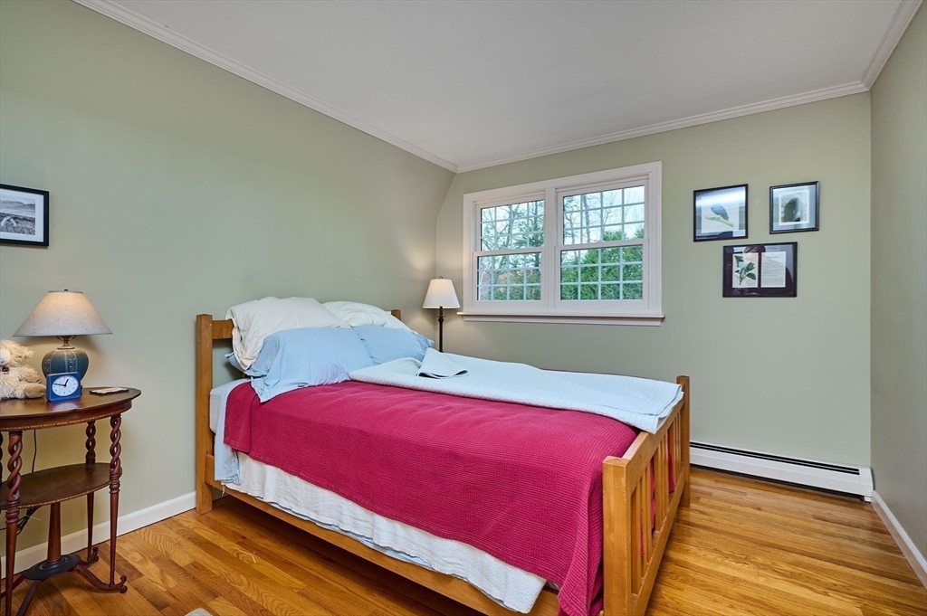 91 Montague Road Westhampton, MA 01027 - Photo 24 of 41 a bedroom with a bed and wooden floor