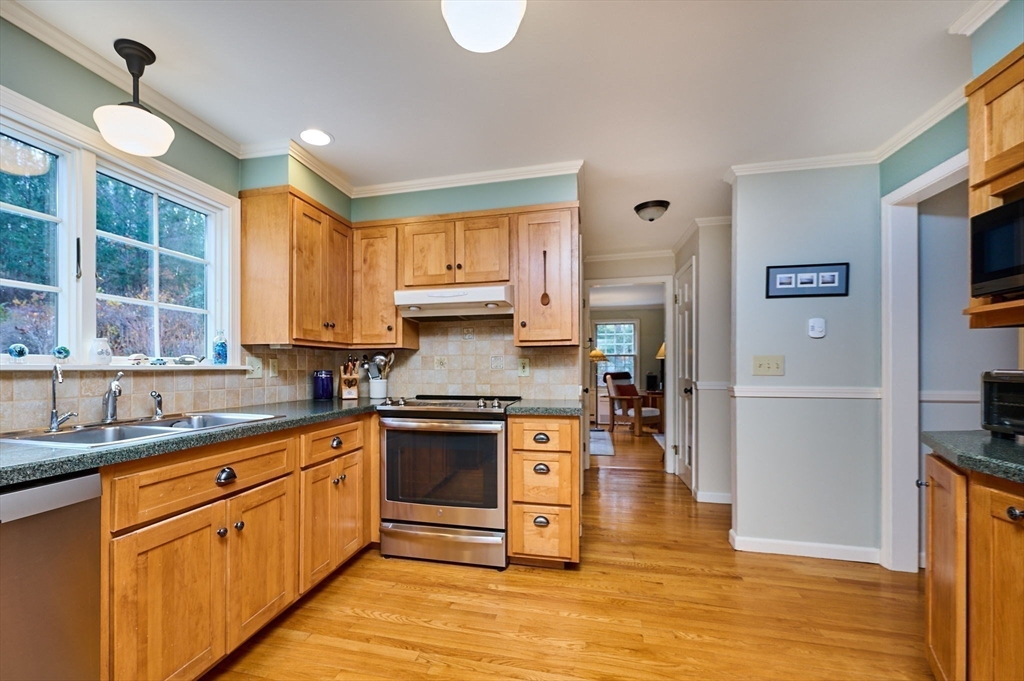 91 Montague Road Westhampton, MA 01027 - Photo 8 of 41 a kitchen with stainless steel appliances granite countertop a sink cabinets and a wooden floor
