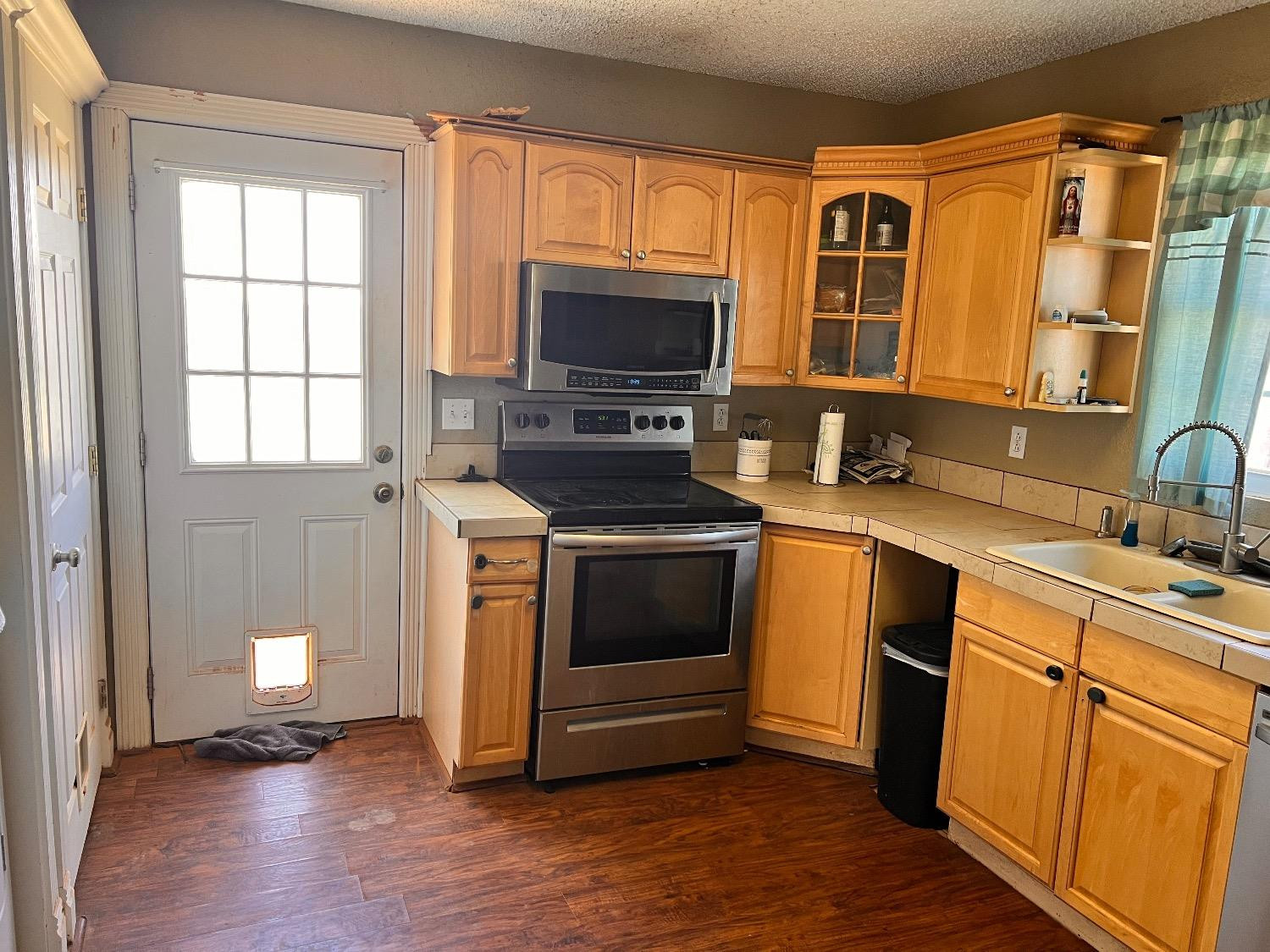 3598 Nightingale Road Ropesville, TX 79358 - Photo 12 of 22 a kitchen with a stove and a sink