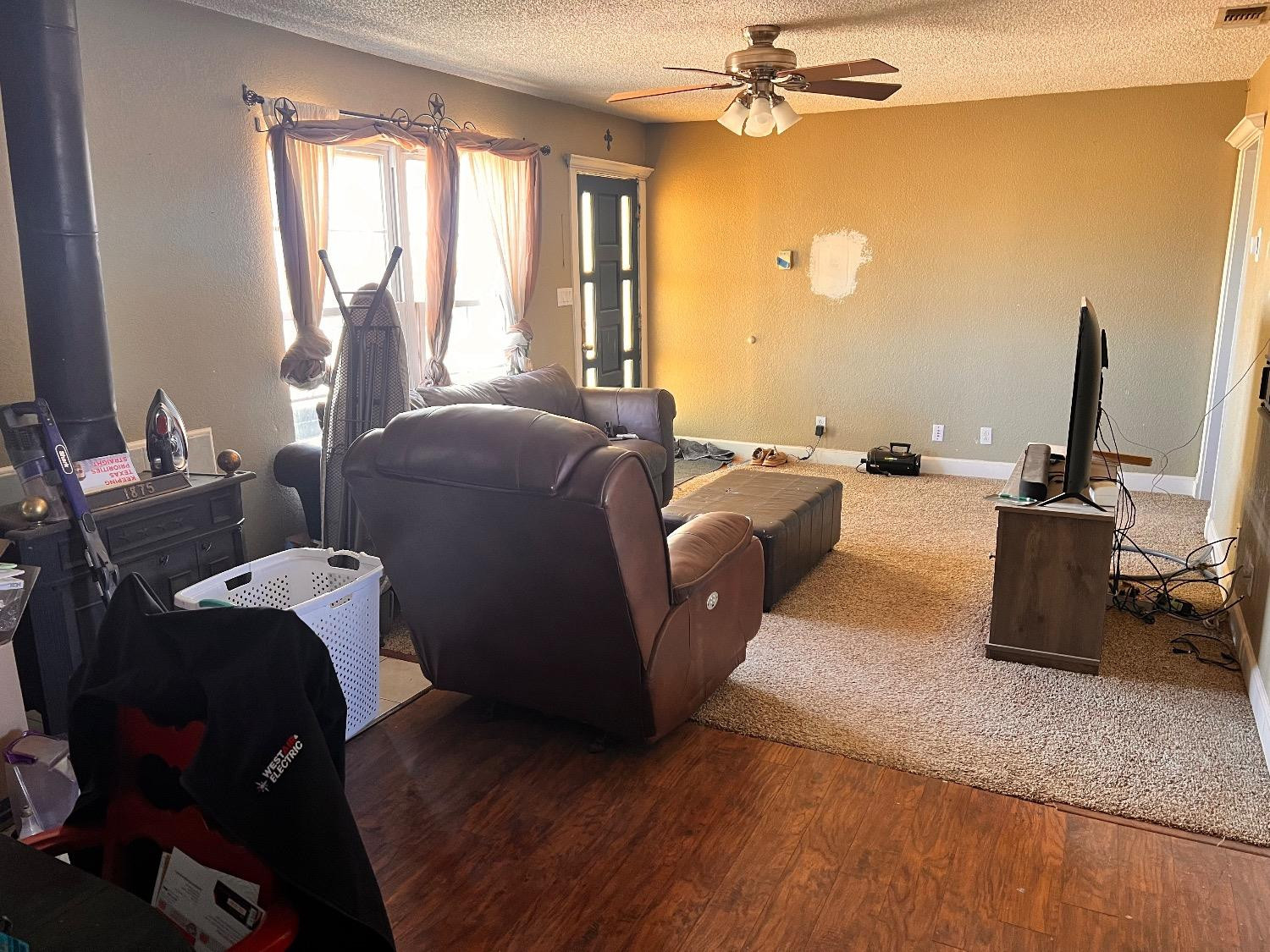 3598 Nightingale Road Ropesville, TX 79358 - Photo 13 of 22 a living room with furniture and a flat screen tv