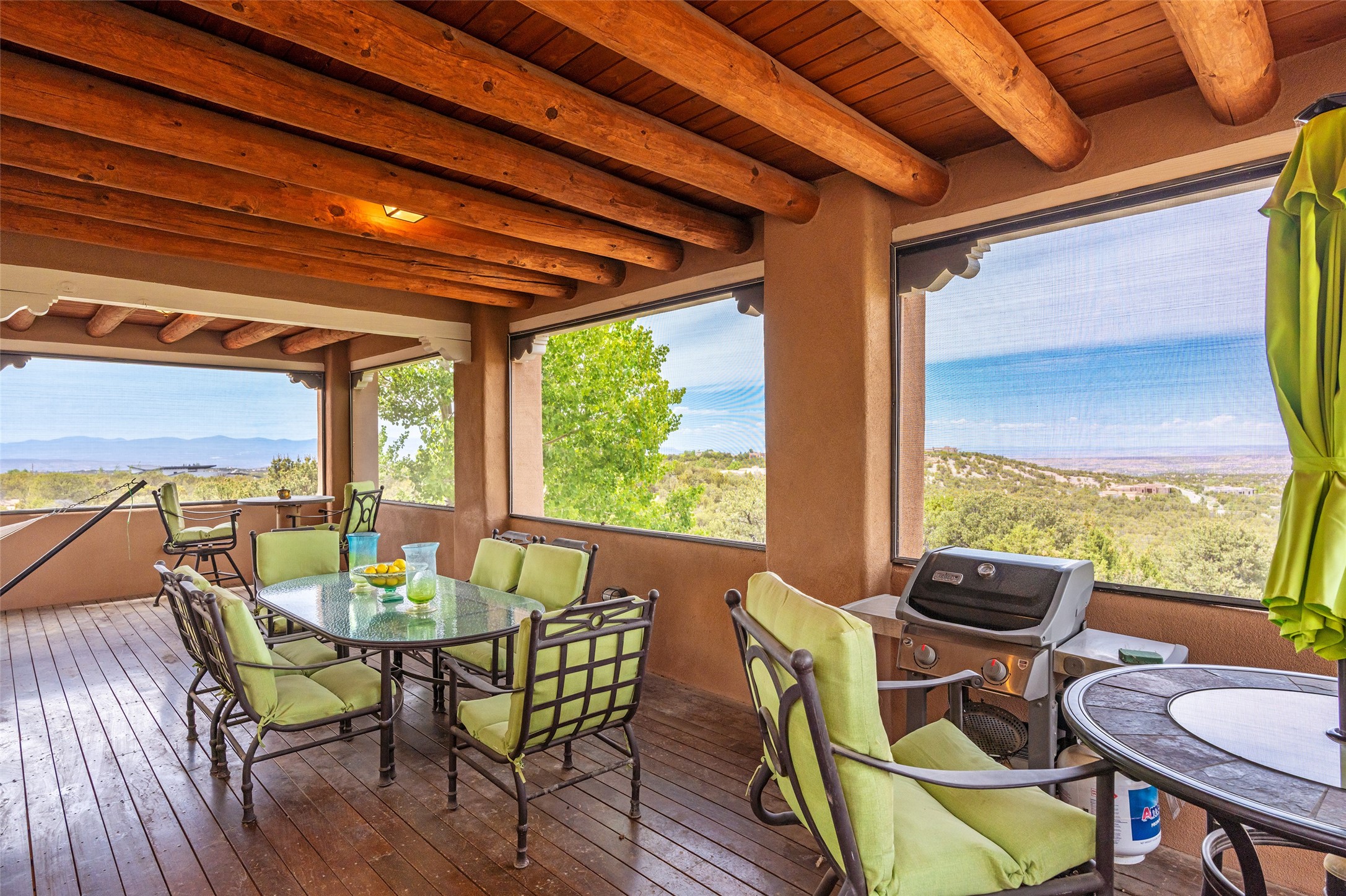 8 San Juan Ranch Road Santa Fe, NM 87506 - Photo 60 of 65 Spacious Covered Portal Porch where you can see Colorado