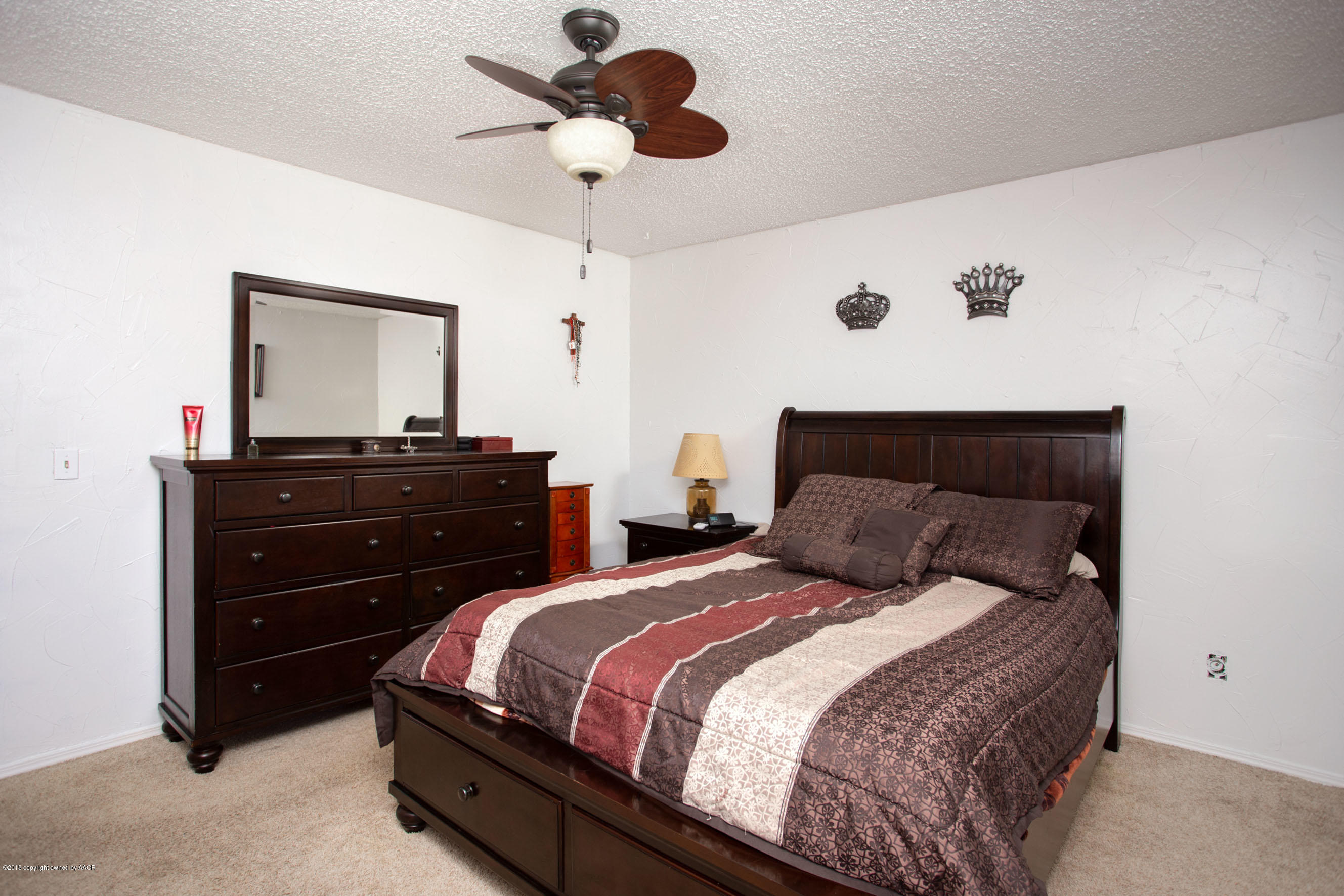 5328 Capulin Lane Amarillo, TX 79110 - Photo 11 of 17 a bedroom with a bed and a closet